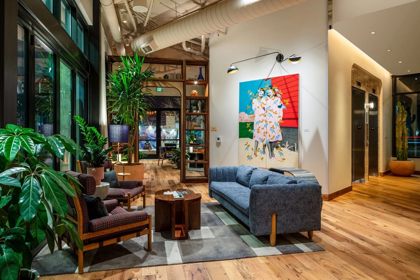 Lobby lounge with sofa, chess table and a bold painting