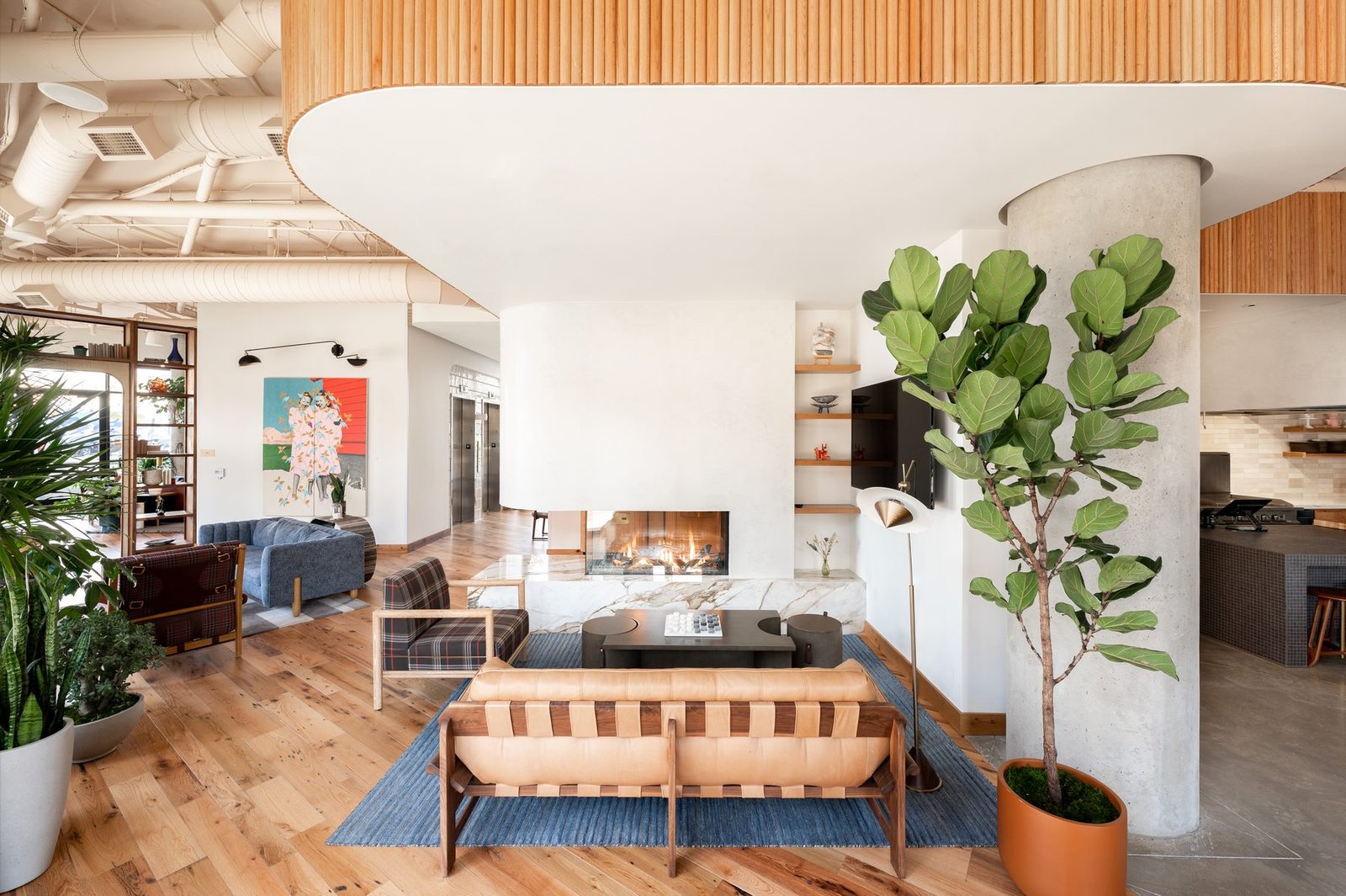 Bright Catbird lobby with mural, shelving and lounge seating
